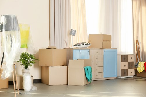 Customer storing boxed belongings in a secure storage unit
