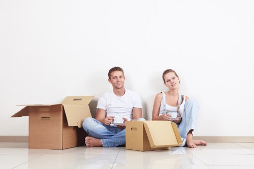 Employee wearing PPE while moving items safely in storage